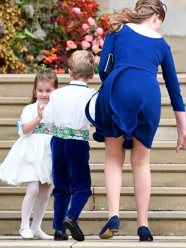 The bridesmaids and page boys proved a handful for their minders. Picture: AFP