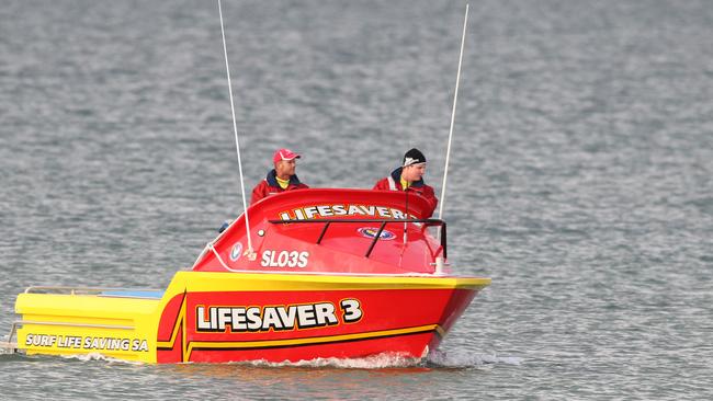 A boat in the water between Henley Beach jetty and Grange jetty this morning, searching for a man possibly missing in the water off Henley Beach. 25/03/15. Picture: Stephen Laffer