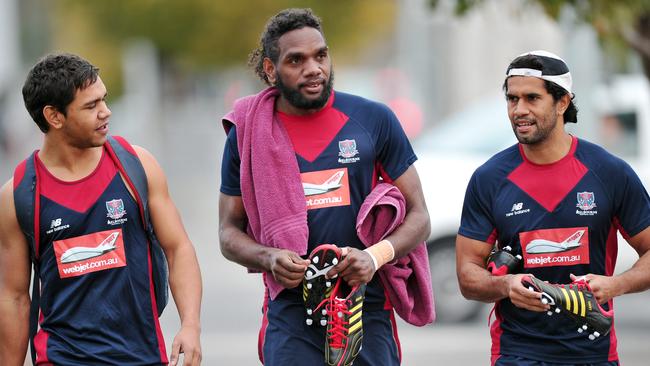 Jurrah (centre) with ex-Melbourne teammates Neville Jetta and Aaron Davey.