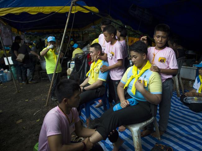 Thai volunteers receive free massage at an outpost in the Tham Luang cave area as the rescue operation continued. Picture: AFP