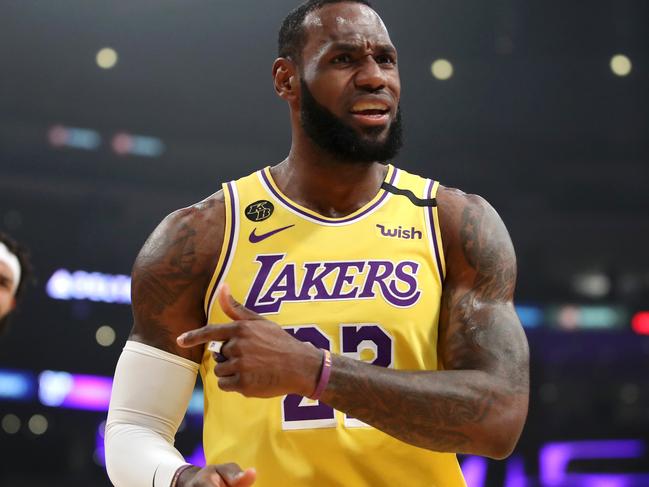 LOS ANGELES, CALIFORNIA - MARCH 03: LeBron James #23 and JaVale McGee #7 of the Los Angeles Lakers react to a play against the Philadelphia 76ers during the first half at Staples Center on March 03, 2020 in Los Angeles, California. NOTE TO USER: User expressly acknowledges and agrees that, by downloading and or using this Photograph, user is consenting to the terms and conditions of the Getty Images License Agreement. (Photo by Katelyn Mulcahy/Getty Images)