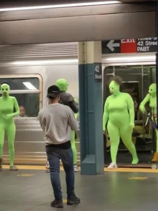 The costumed women getting off a Subway train. Picture: YouTube/SuperFriendsNYC