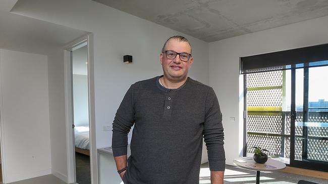 Garry Liakoureas, who was a client in the old Ozanam House building, is pictured at the new building in Flemington Road. Picture: Ian Currie