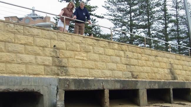 Petra and Tony Horwood of Terrigal Haven Supports Group at seven drains, Terrigal where sewage gushed from the stormwater drain. Picture: Cathy Stubbs.