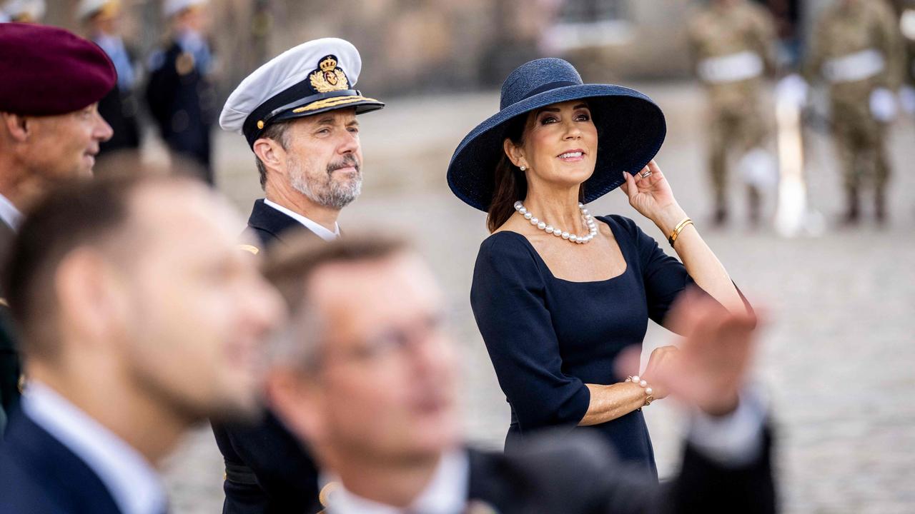 Queen Mary of Denmark and King Frederik X watch overflying fighter jets at the parade on Denmark's flag day. Picture: AFP.