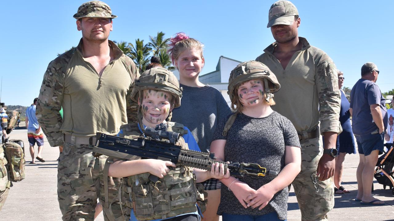 40 Commando Royal Marines Lance Corporal Gary Haggitt and Marine Remel Jordan from Taunton, England, with Bowen kids Chase Howlett, Angel Reid, Zeke Howlett, and Sasha Reid at the Exercise Talisman Sabre open day. Picture: Kirra Grimes