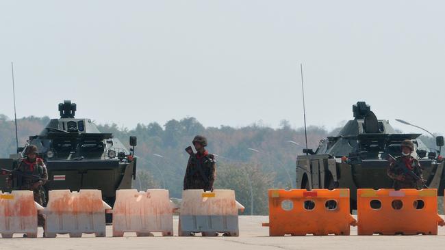 Soldiers stand guard on a blockaded road to Myanmar's parliament in Naypyidaw. Picture: AFP.