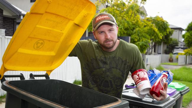 Newport resident Jacob Matray with items you can no longer put in the recycling bins.