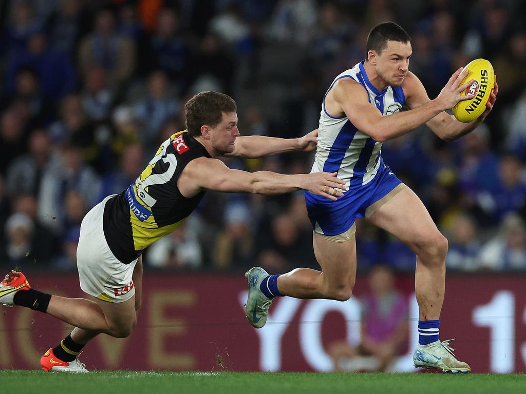 Luke Davies-Uniacke breaks away from Jacob Hopper. Picture: Daniel Pockett/Getty Images