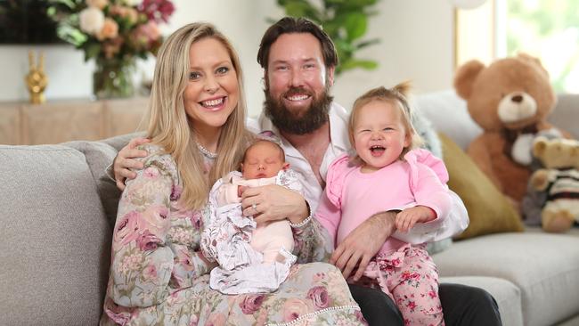 Charli Robinson and Liam Talbot with their new born daughter Theadora and Kensington, 18 months. Picture: Peter Wallis