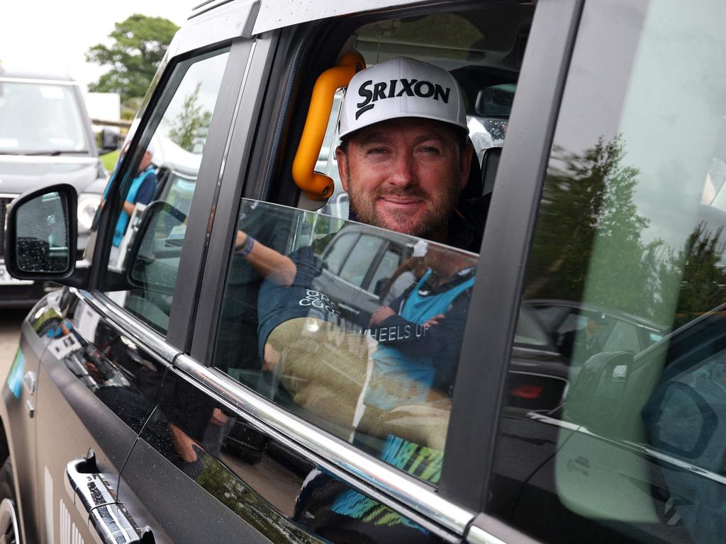 Graeme McDowell looks from the window of his black cab as he goes to the third tee to begin his round on the first day of the LIV Golf Invitational Series event at The Centurion Club. Picture: Adrian Dennis/AFP