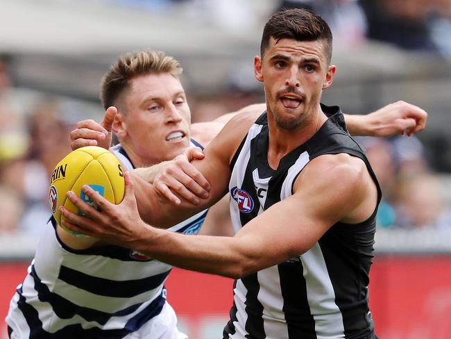 Collingwood’s Scott Pendlebury breaks a Mark Blicavs tackle. Picture: Michael Klein