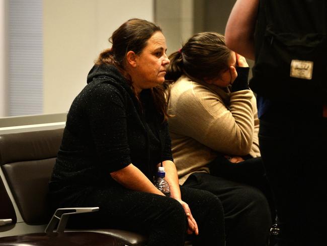 Ms Evans pulled her hoodie up while her daughter covered her face before seeking refuge in the toilets prior to boarding. Picture: Greg Higgs