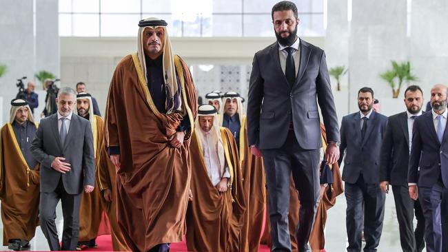 Syria’s new ruler, Ahmed al-Sharaa (right) welcomes Qatari Prime Minister Sheikh Mohammed bin Abdulrahman bin Jassimal-Thani to Damascus on January 16 … Picture: AFP / HO / SANA