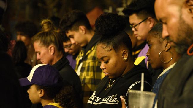 Solemn Lakers fans gather to pay their respects to Kobe Bryant.