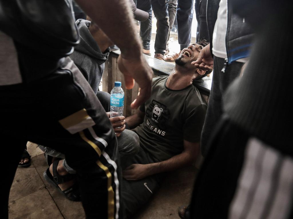 People injured in Israeli raids arrive at Nasser Medical Hospital. Picture: Getty Images