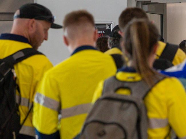 FIFO mine workers board a Qantas flight to Newman at Perth domestic airport in Perth on Tuesday, December 8, 2020. (AAP Image/Richard Wainwright) NO ARCHIVING