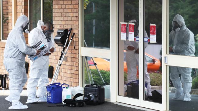 Cleaners are seen entering the Estia Health aged care facility in Ardeer in July. Picture: David Crosling.