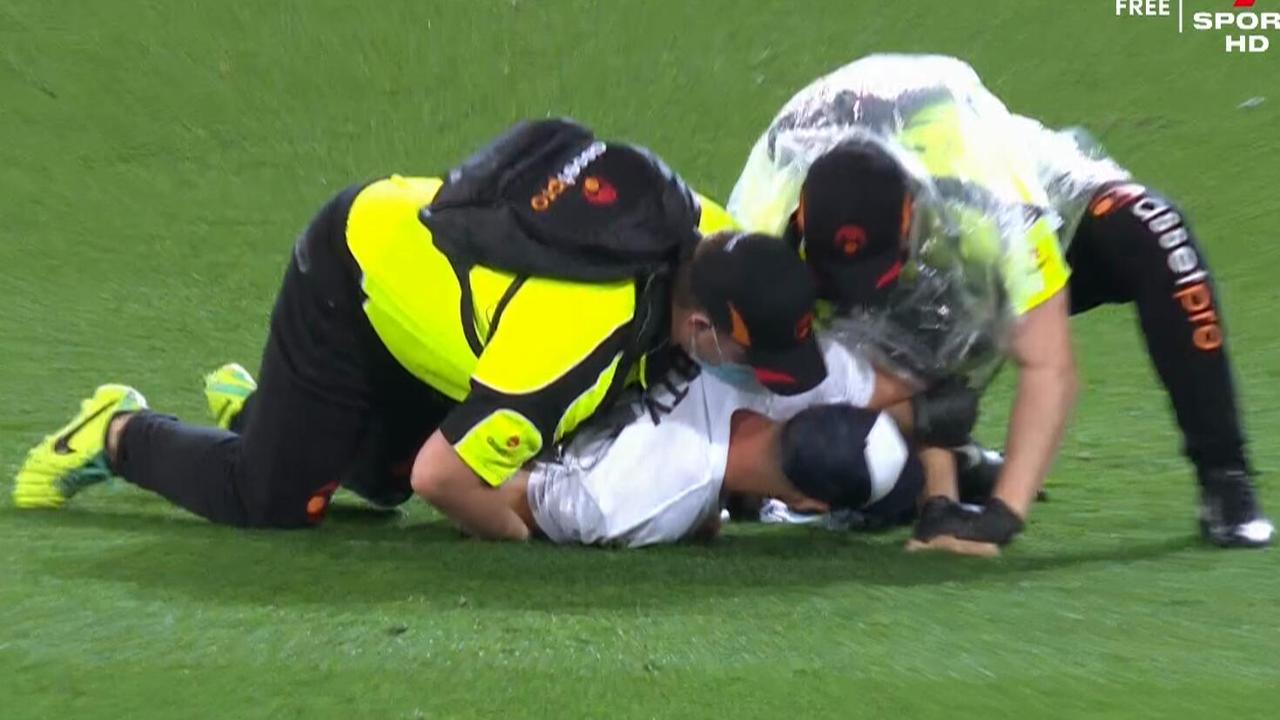 A few ballsy pitch invaders interrupted the first quarter of the Grand Final.