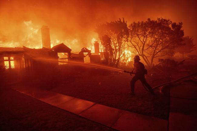 Los Angeles County Fire Chief Anthony Marrone said his crews were overwhelmed by the scale and speed of the unfolding disasters. Picture: AP<br/>