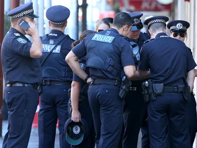 14.4.2014. The City paper's regular photo depicting a certain vibe of the city at different times.Police lineup for coffee in Hindley St at 8.45am.   pic tait schmaal.