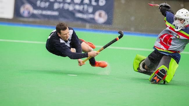 Derwent’s Paul Ancher shoots past OHA keeper Henry Chambers during the penalty shootout. Picture: Richard Jupe