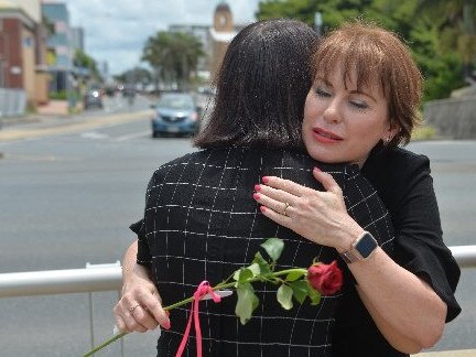 Broken Ballerina Foundation director Jules Thompson comforting a fellow victim of domestic violence at the Red Rose Rally in Mackay last year. Broken Ballerina provides a much needed service for survivors in Mackay.