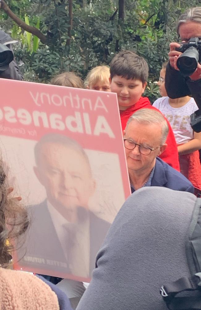 Anthony Albanese is swamped by supporters while getting a coffee after his election victory. Picture: Mark Jones