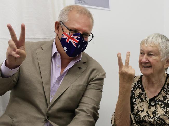 The moment Jane Milysiak accidentally did an ‘up yours’ sign with Scott Morrison, capturing the nation’s heart. Picture: Mark Evans/Getty Images