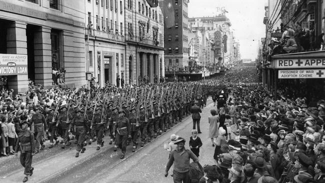 The Australian Army 7th Division, march along Queen Street Brisbane watched by thousands of people. Picture: The Courier-Mail Photo Archive. 