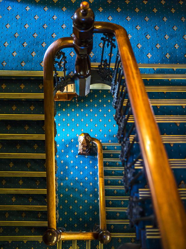 The Lenna's impressive staircase which includes balustrade which is said to have been imported all the way from London, and the wrought iron holding up the railing that was cast at a nearby foundry in Battery Point.