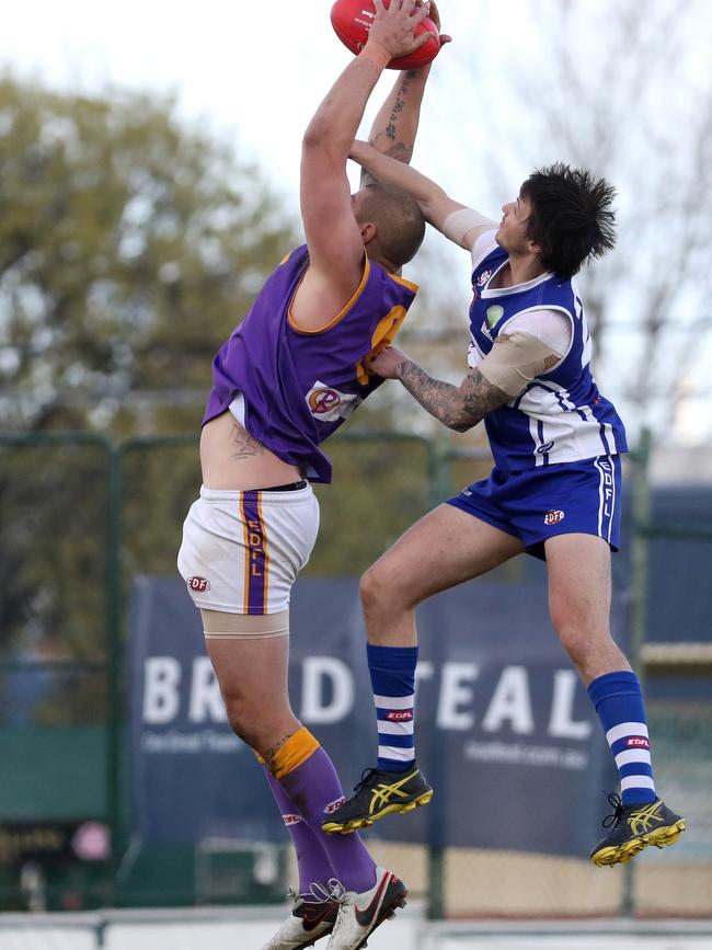 Cameron Cloke rises to take a contested mark for Jacana. Picture: Mark Dadswell