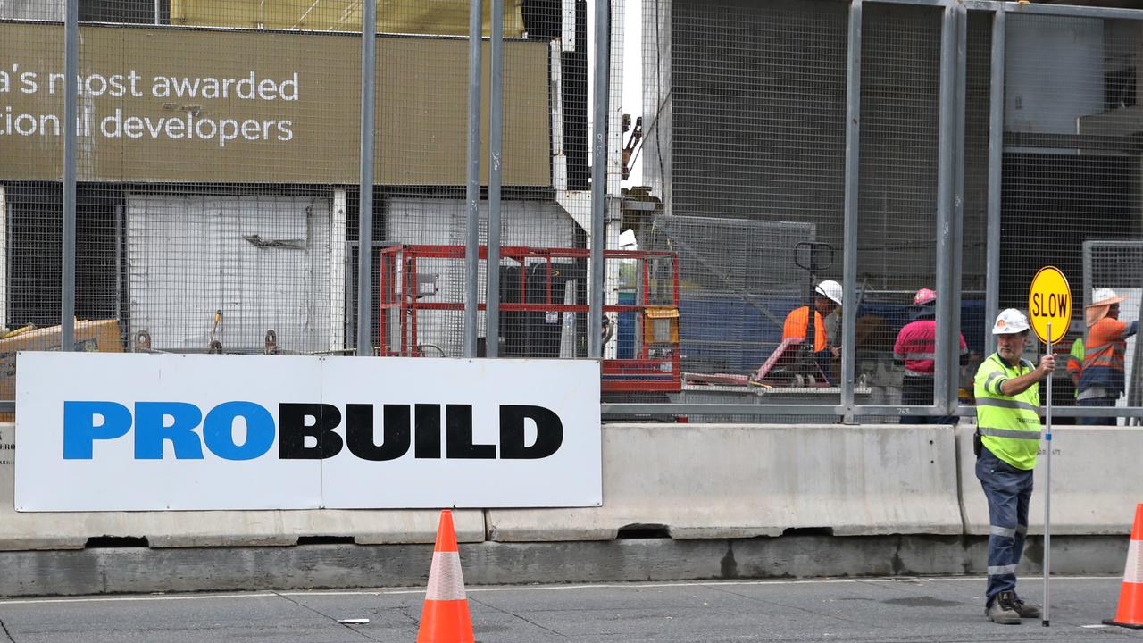 Workers leave the Probuild worksite on 443 Queens Street. Picture: Zak Simmonds