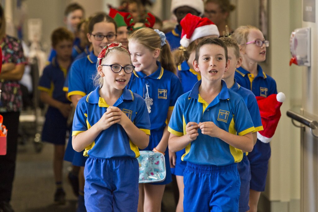 Leading the group are Lila Sullivan and Oscar Ghidella as Mater Dei Primary School Yr 4 students sing Christmas carols in the wards of St Vincent's Private Hospital, Friday, November 29, 2019. Picture: Kevin Farmer