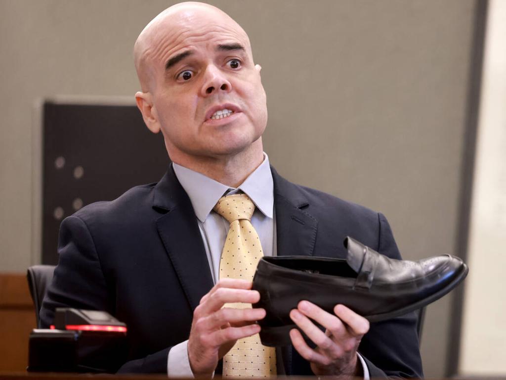 Robert Telles shows that he wears shoe lifts during his narrative on the witness stand on the ninth day of his murder trial. Picture: Getty Images