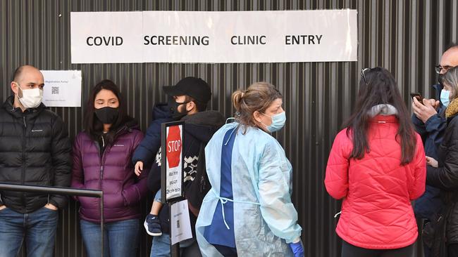 People queue up to be tested for coronavirus at the Royal Melbourne Hospital. Picture: William West/AFP