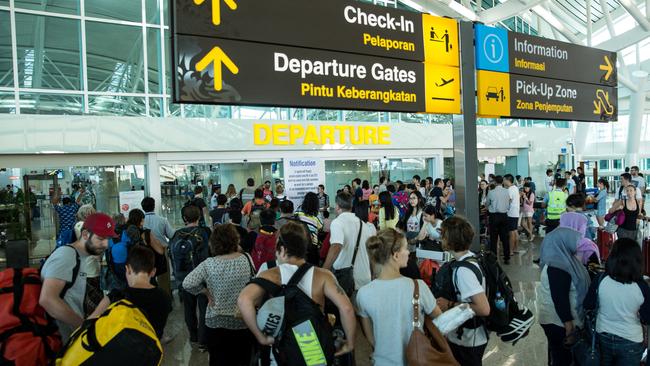 DENPASAR, BALI, INDONESIA - JULY 13:  Foreign tourists arrive at Ngurah Rai International airport departure on July 13, 2015 in Denpasar, Bali, Indonesia. Bali's international airport reopened after being closed due to volcanic ash clouds from Maunt Raung, but Australia's main carriers to the holiday destinations are still not flying. (Photo by Agung Parameswara/Getty Images)