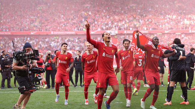 Virgil van Dijk of Liverpool leads the celebrations. Photo by Carl Recine/Getty Images.