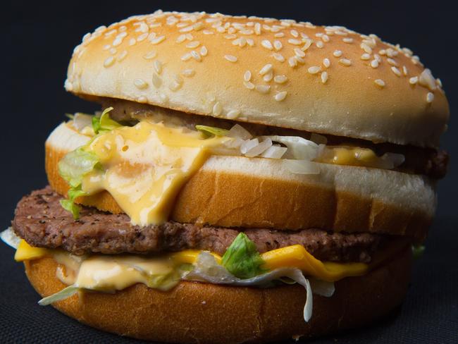 (FILES) This file photo taken on November 2, 2010 shows a photo of a McDonalds' Big Mac hamburger. McDonald's announced March 30, 2017 it will shift to fresh beef in its new made-to-order Quarter Pounder hamburgers in most US restaurants as it seeks to beef up sales in its home market. The fast-food chain by mid-2018 will shift away from frozen beef on the popular hamburger, which will be cooked at the time of order, the company said in a news release. The change, which does not affect the Big Mac and other beef products, follows a trial run in about 400 restaurants in Texas and Oklahoma that was well received.  / AFP PHOTO / Paul J. Richards