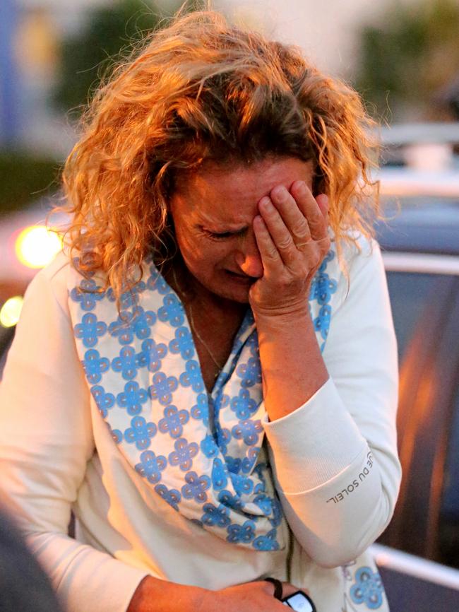 Resident Zaza Silk nearly collapses when she sees her home. Picture: John Grainger