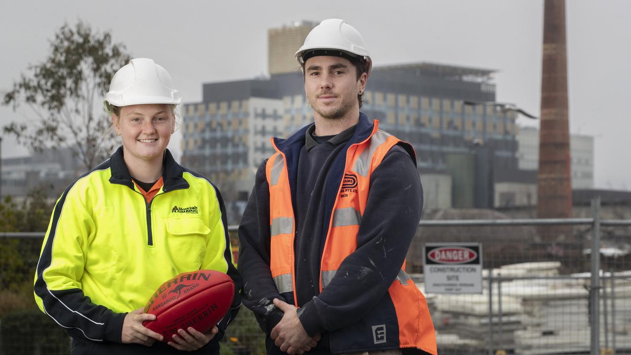 Devils footballer and second-year plumbing apprentice Halle Whitehead and third-year carpentry apprentice Ben Shea at Macquarie Point. Picture: Chris Kidd