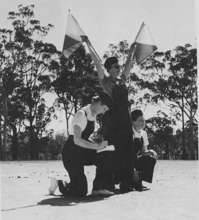 Members of the Women's Emergency Signalling Corps practising semaphore in 1940. Picture: Australian War Memorial.