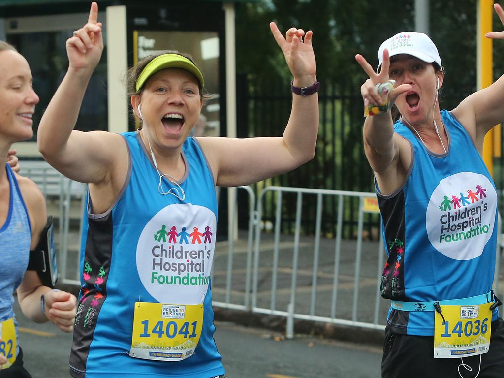 <p>Vanessa Gillman and Sharyn Vacher in the 10km run at the Sunday Mail Bridge to Brisbane fun Run, Sunday August 26, 2018. (AAP Image/Jono Searle)</p>