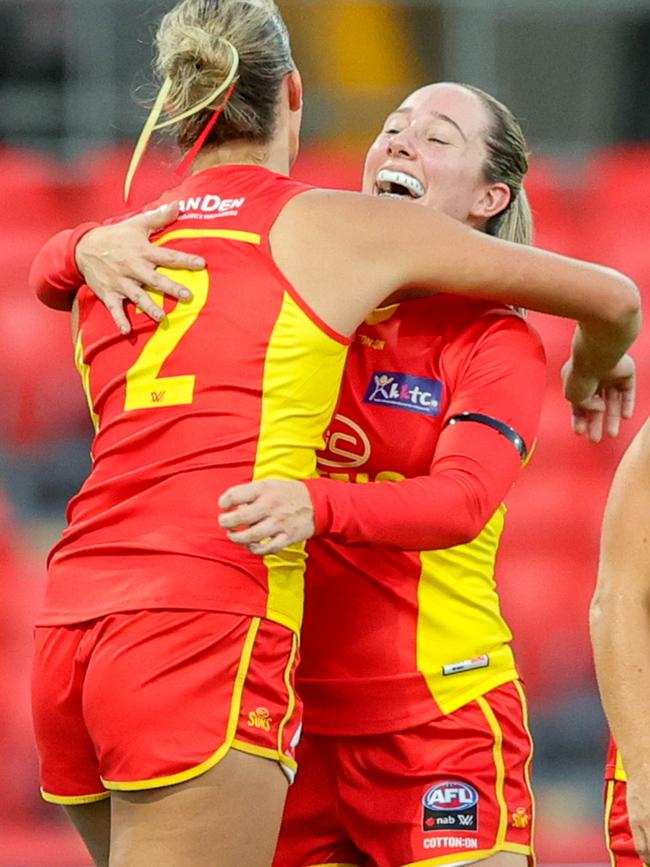 Lauren Bella celebrates a goal at Metricon Stadium.