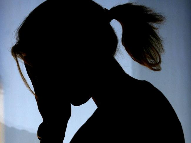 30/11/2007 FEATURES: Silhouette - generic of woman female crying, feeling sad and emotional.