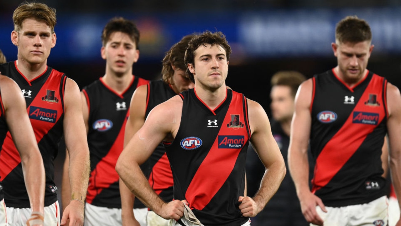 MELBOURNE, AUSTRALIA - MAY 01: Andrew McGrath and his Bombers's team mates look dejected after losing the round seven AFL match between the Western Bulldogs and the Essendon Bombers at Marvel Stadium on May 01, 2022 in Melbourne, Australia. (Photo by Quinn Rooney/Getty Images)