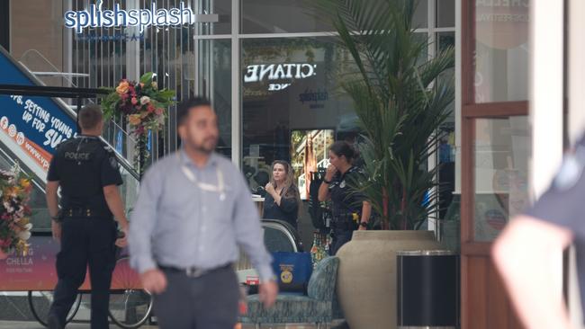 Police at Cairns Central after the alleged stabbing murder.