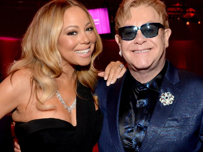 WEST HOLLYWOOD, CA - FEBRUARY 28: Recording artist Mariah Carey (L) and host Sir Elton John attend the 24th Annual Elton John AIDS Foundation's Oscar Viewing Party at The City of West Hollywood Park on February 28, 2016 in West Hollywood, California. (Photo by Michael Kovac/Getty Images for EJAF)