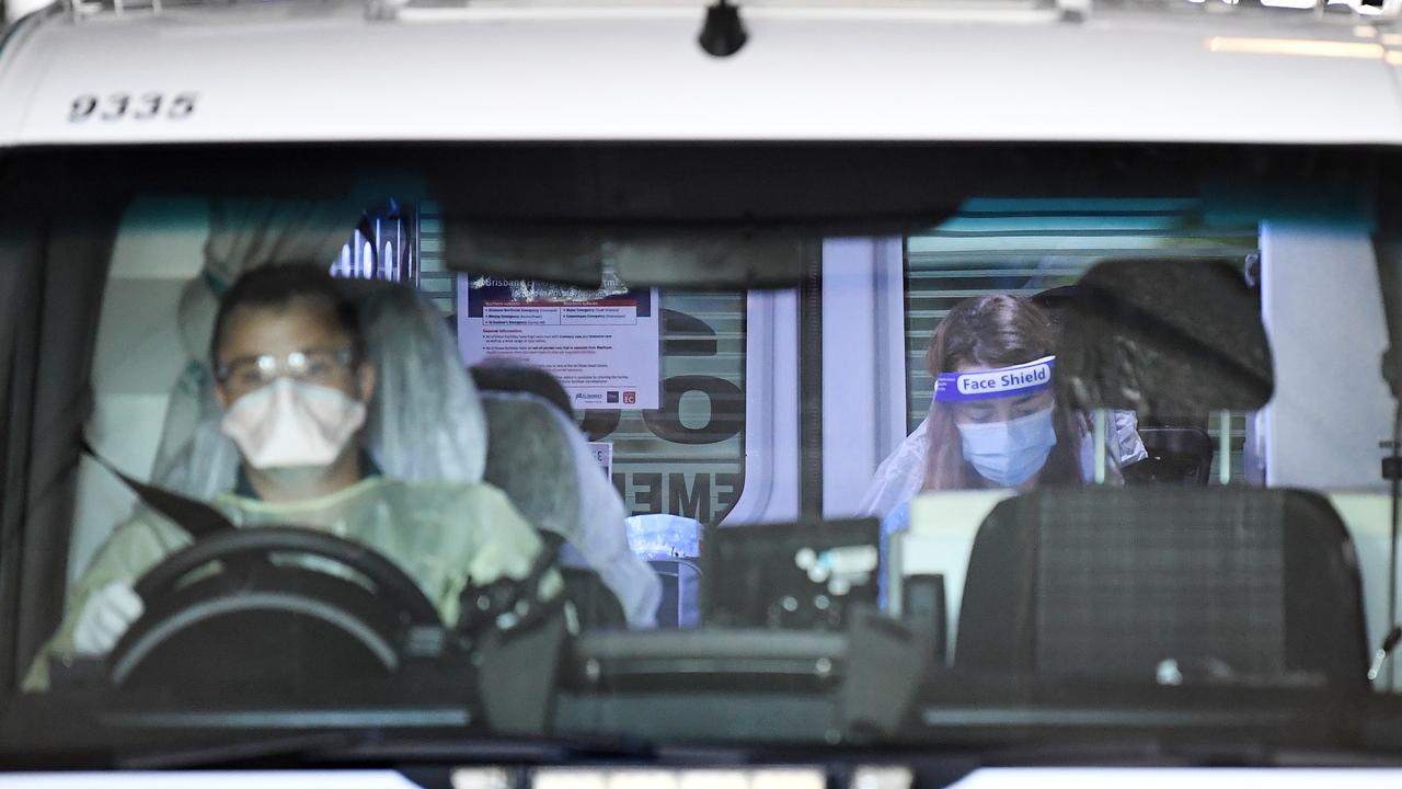 An Ambulance crew transports a quarantined guest from the Hotel Grand Chancellor in Spring Hill, Brisbane. Picture: Dan Peled