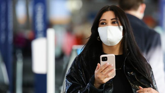A woman wears a face mask at Sydney Domestic Airport. Picture: NCA NewsWire / Gaye Gerard